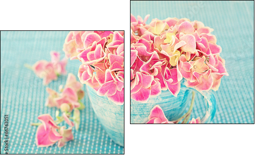 Pink hydrangea flowers in a cup on a blue background . - Two-piece canvas print, Diptych