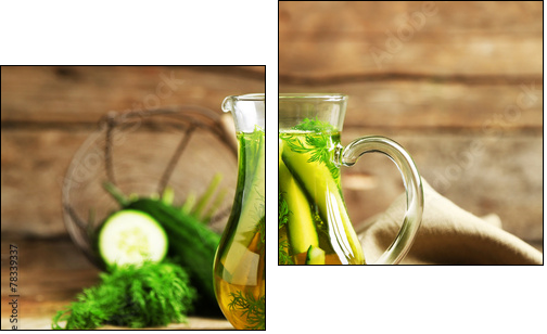 Glass ewer with fresh organic cucumber water on wooden table - Two-piece canvas print, Diptych