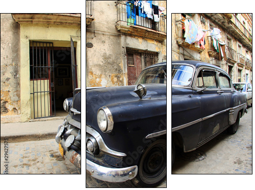 A classic old car is black color parked in front of the building - Three-piece canvas print, Triptych