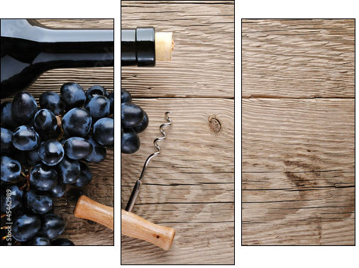 Bottle of wine, corkscrew and grape on wooden background - Three-piece canvas print, Triptych