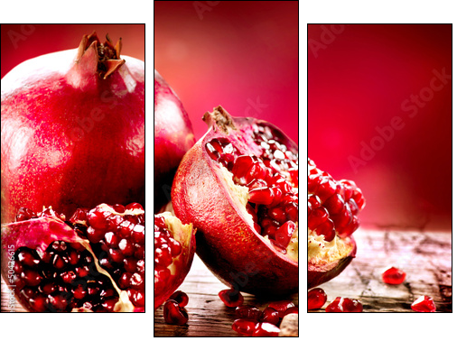 Pomegranates over Red Background. Organic Bio fruits - Three-piece canvas print, Triptych