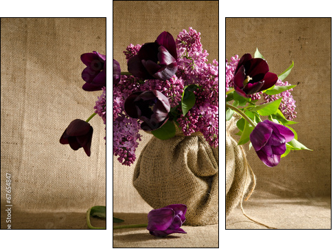 Beautiful bouquet of tulips with sprigs of lilac in a vase on a - Three-piece canvas print, Triptych