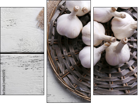 Fresh garlic on wicker mat, on wooden background - Three-piece canvas print, Triptych