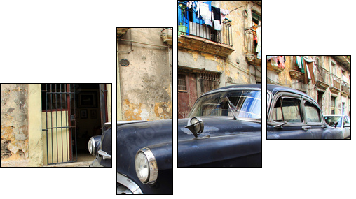 A classic old car is black color parked in front of the building - Four-piece canvas print, Fortyk
