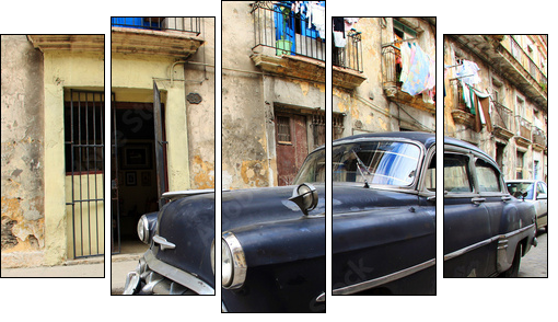 A classic old car is black color parked in front of the building - Five-piece canvas print, Pentaptych