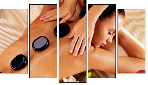 Adult woman having hot stone massage in spa salon - Five-piece canvas print, Pentaptych